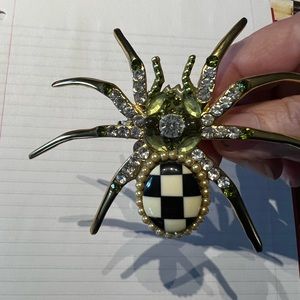 4 Mackenzie Childs Spider napkin rings.